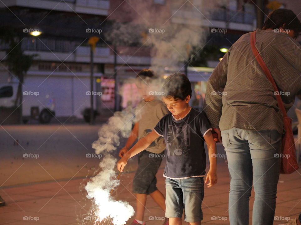 young people playing with firecrackers
