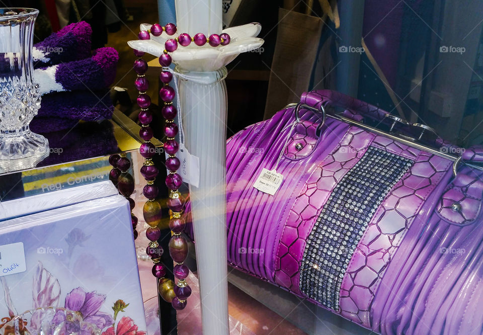 A purple display in a second hand shop window