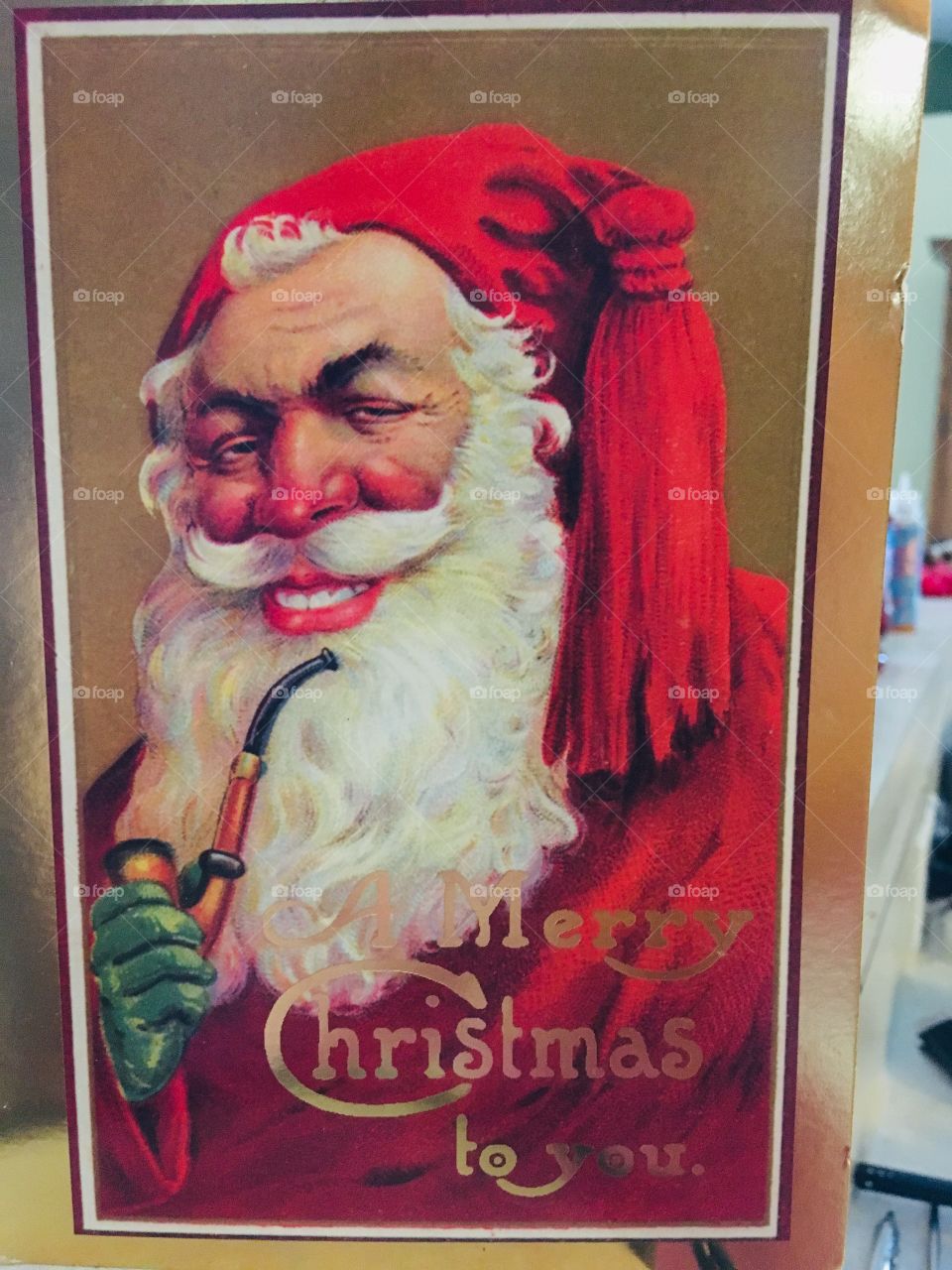 Creepiest Santa I have EVER seen. Santa has a pipe and dressed in red with black eyebrows 😳