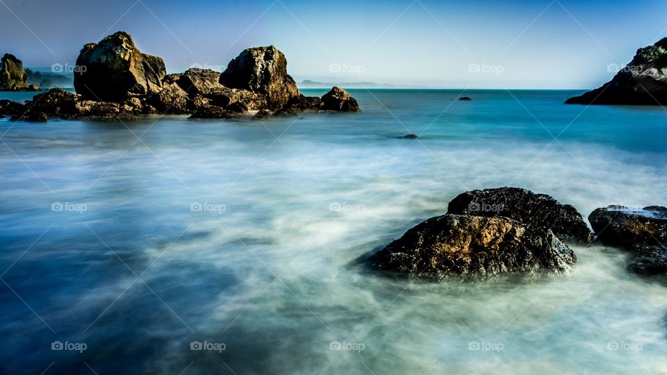 View of cliff in sea