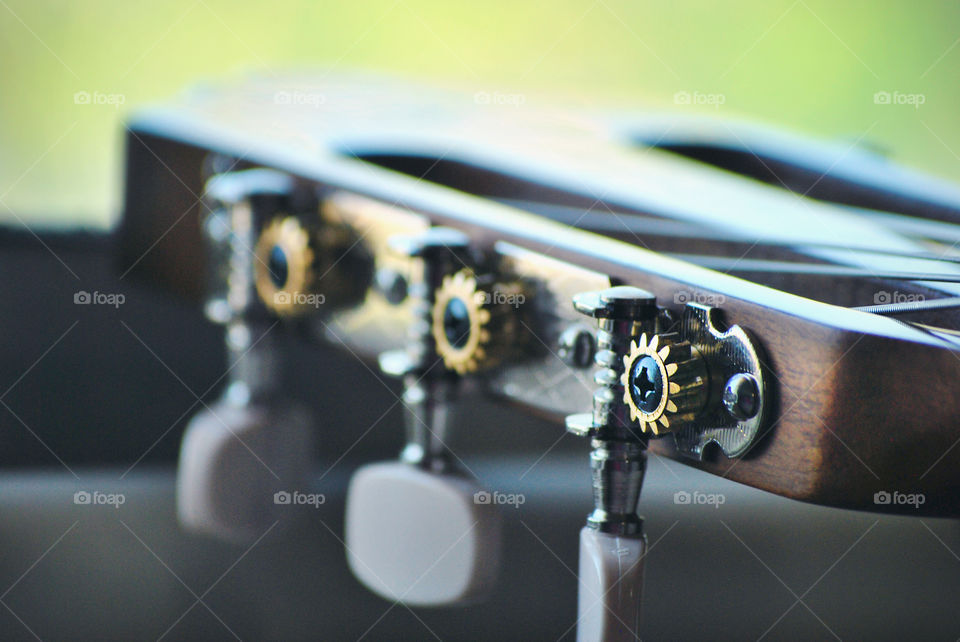 macro shot, acoustic guitar head, tuner, closeup