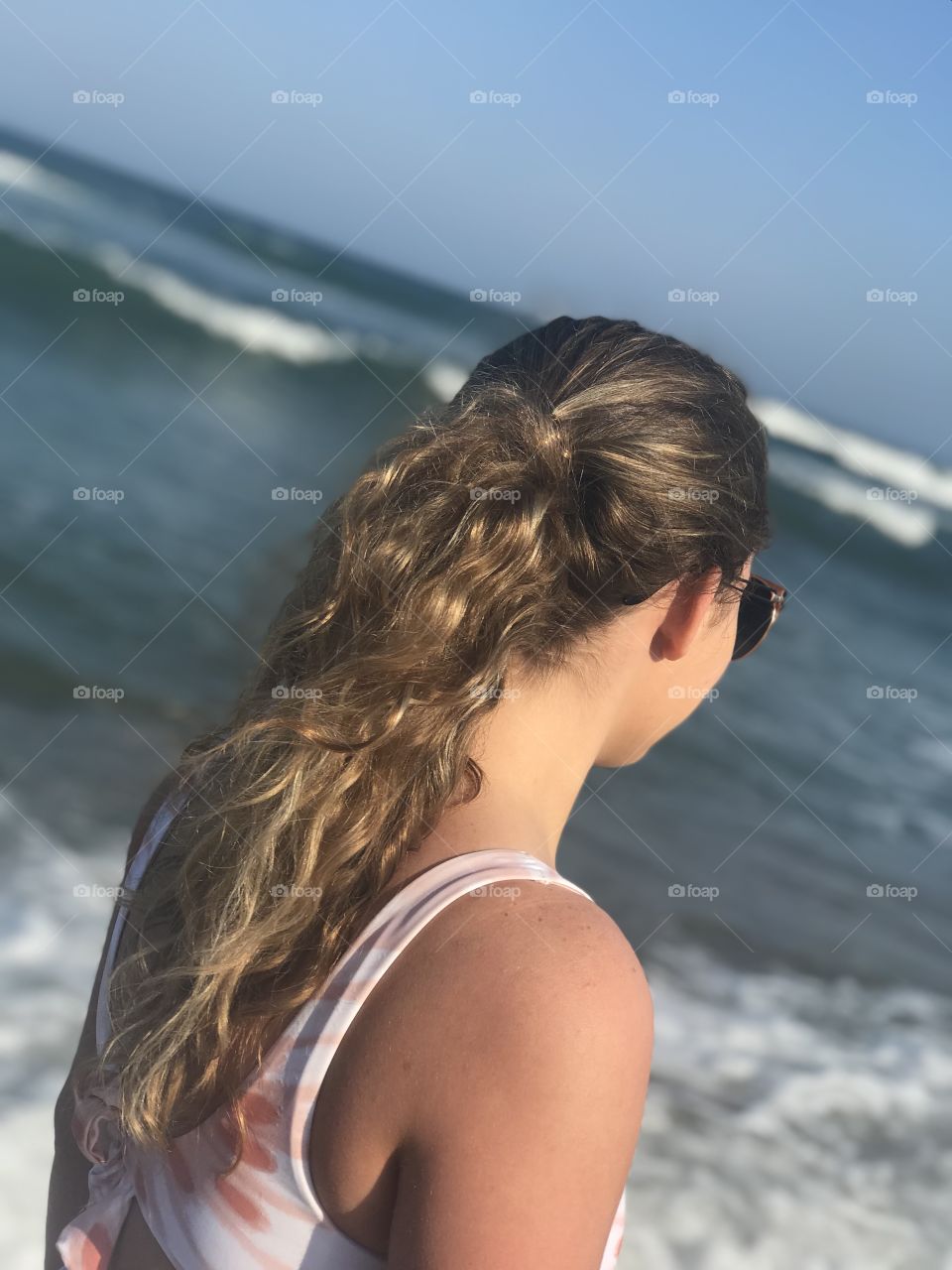 Girl walking on the beach 