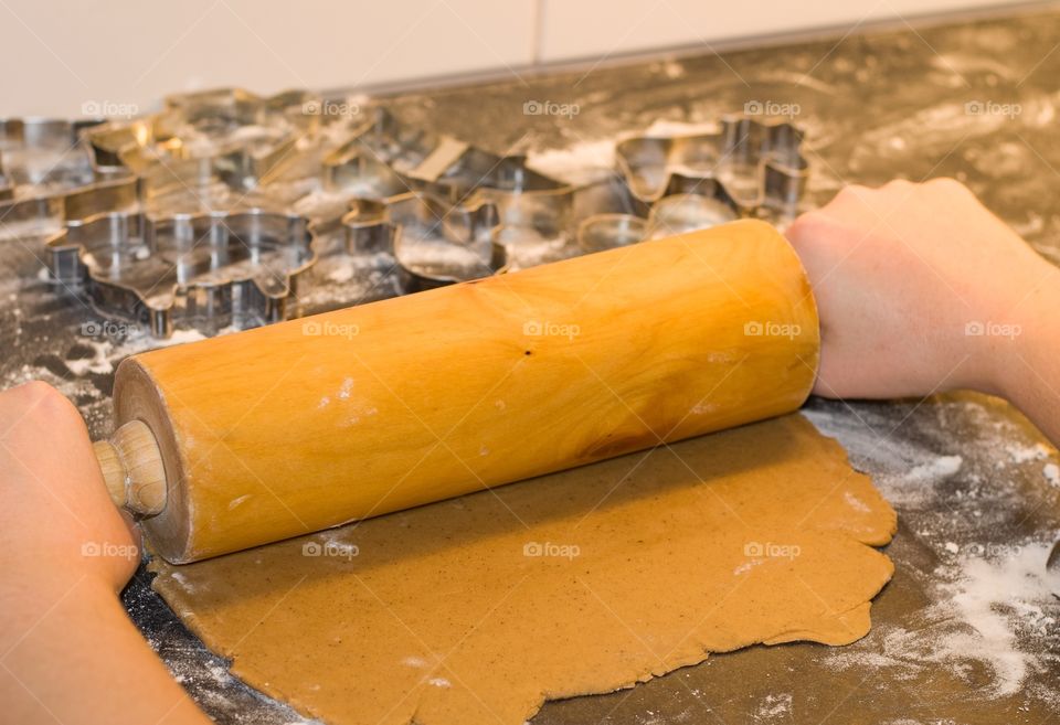 A person making a ginger bread cookies