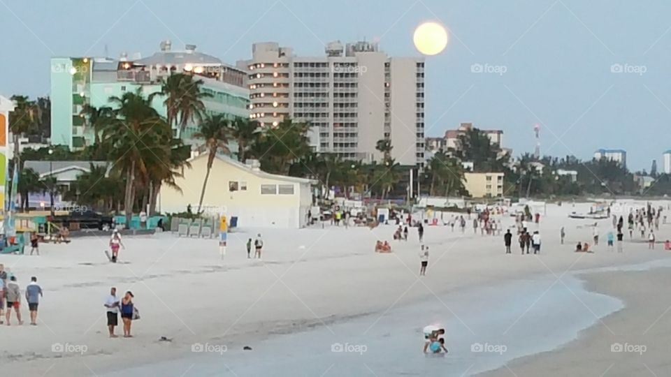 beach full moon at sunset