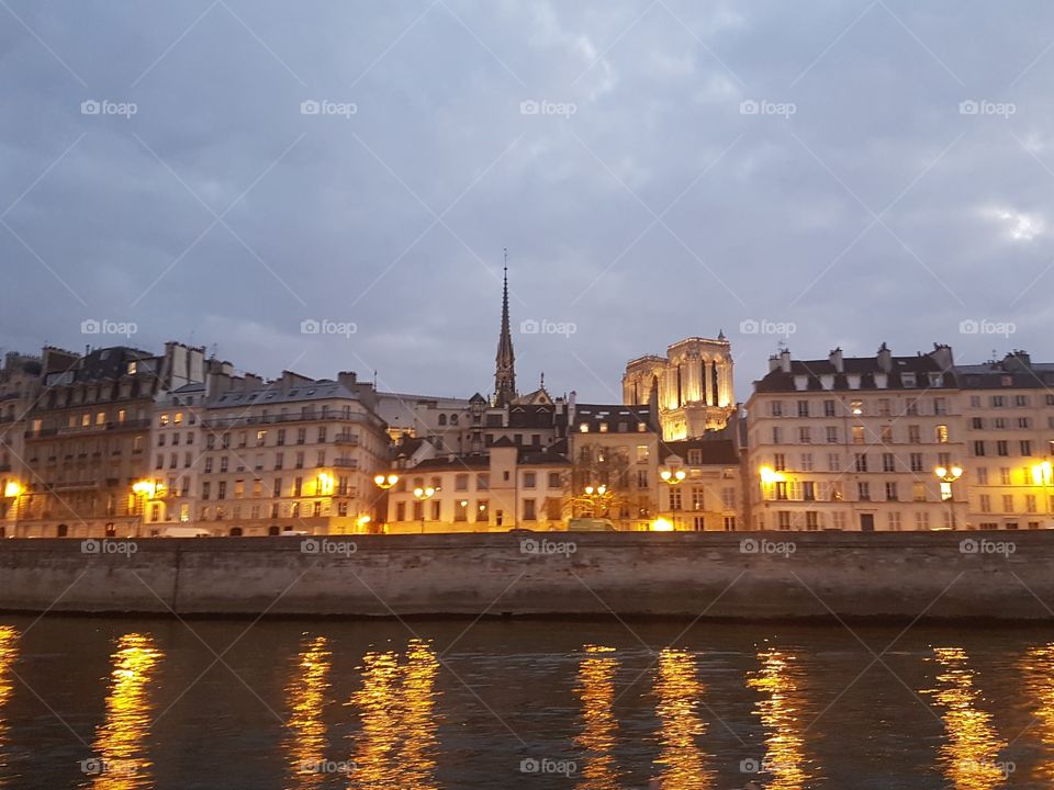 Night sky and lit buildings along the Seine