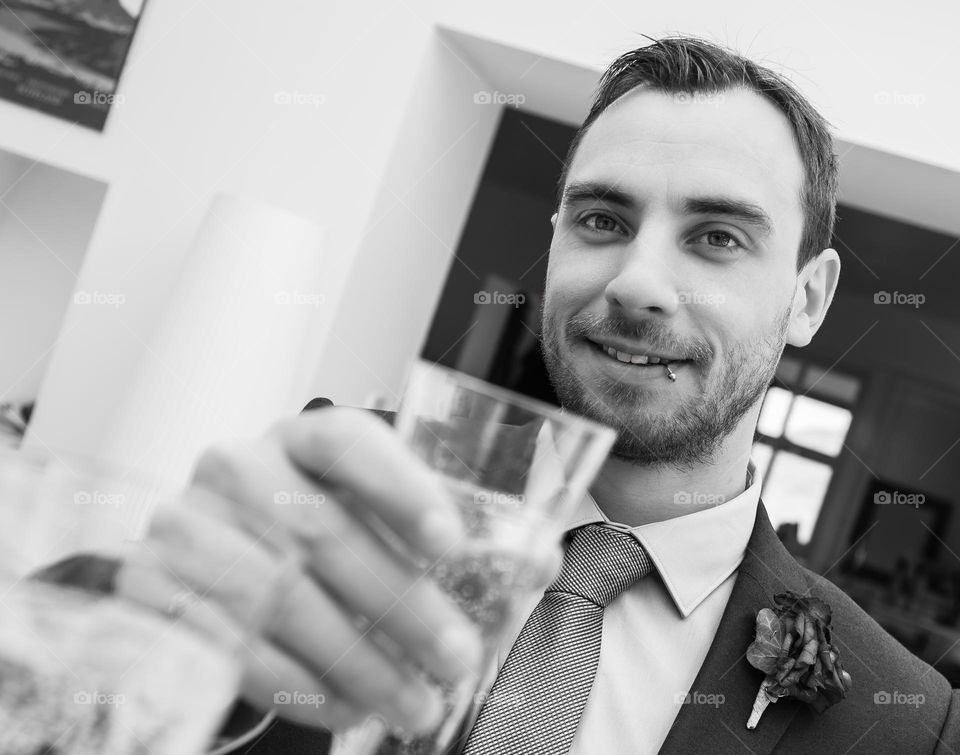 A photo I took of my husband on our wedding day, toasting each other with champagne 