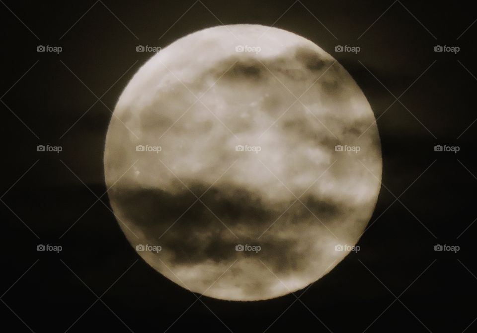 MOON surrounded by dark cloud