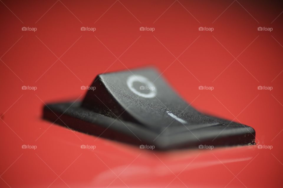 Macro photo of on and off button with red background 