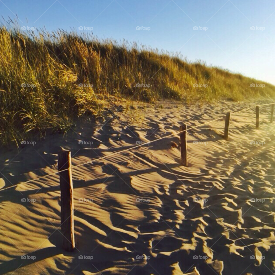 Walking on the beach at sunset. Walking on the beach at sunset