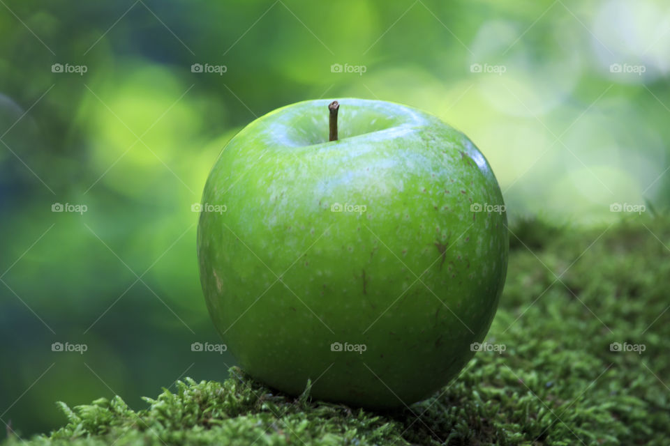 Green apple in green nature 