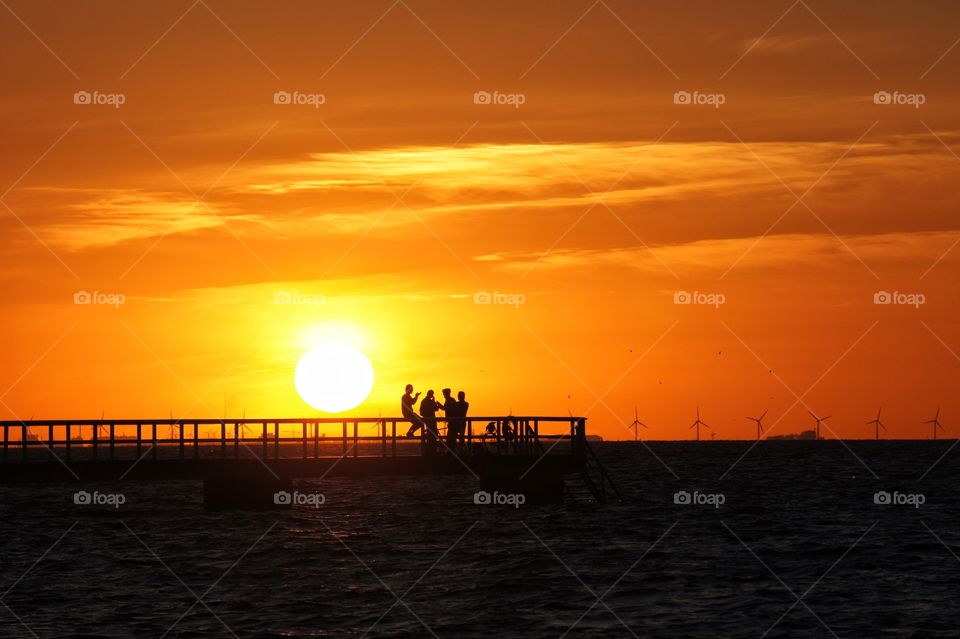 Silhouettes on the jetty