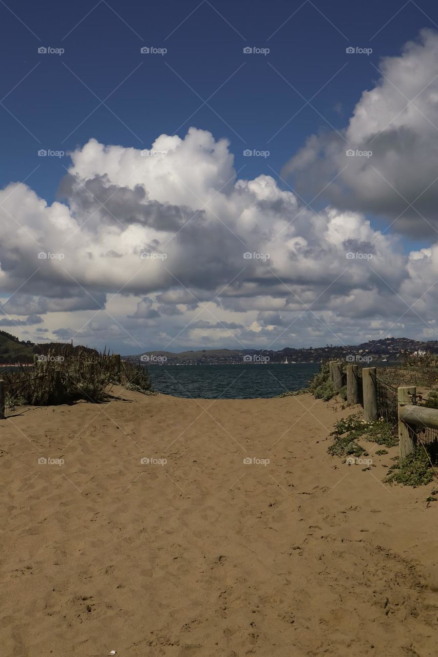 Sandy pathway from Chrissy field in San Francisco to the beautiful waters of the bay, warm cloudy afternoon 