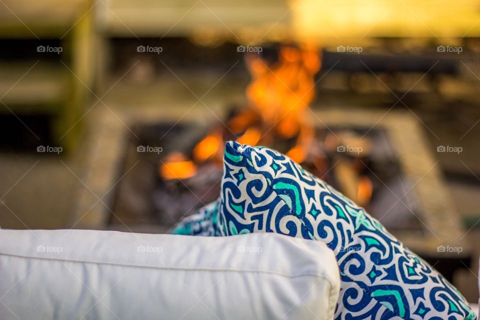 Cozy cushions by a summer fire