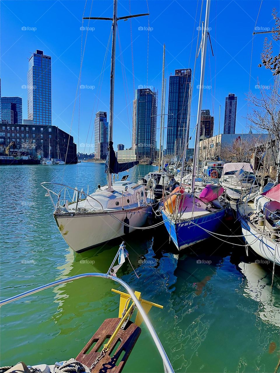 This is “Newtown Creek” by the “Pulaski Bridge” seen from aboard “Salvation”, the “28 foot 1969 Luhrs” cabin cruiser that I and my partner for many years, “Timothy Trespas” call home on a bright sunshiny day in February 2024. Hypnotic Productions