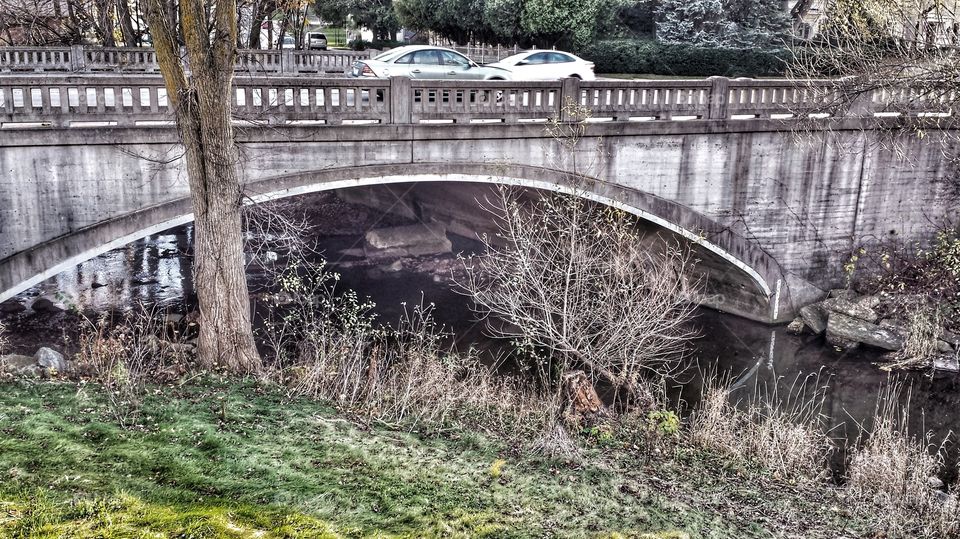 Cars Crossing Creek Bridge