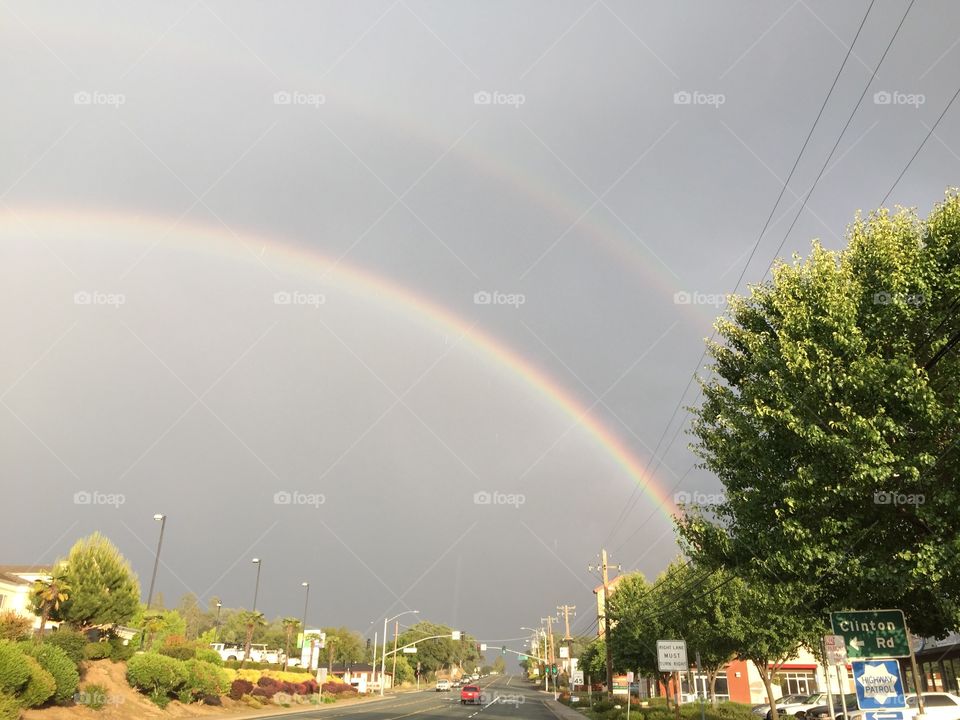 Double rainbow grey sky. Double rainbow against a grey sky in California