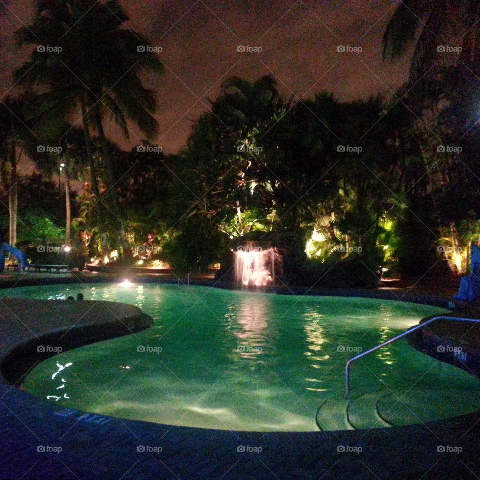 Cool Pool. night time outside at a hotel pool