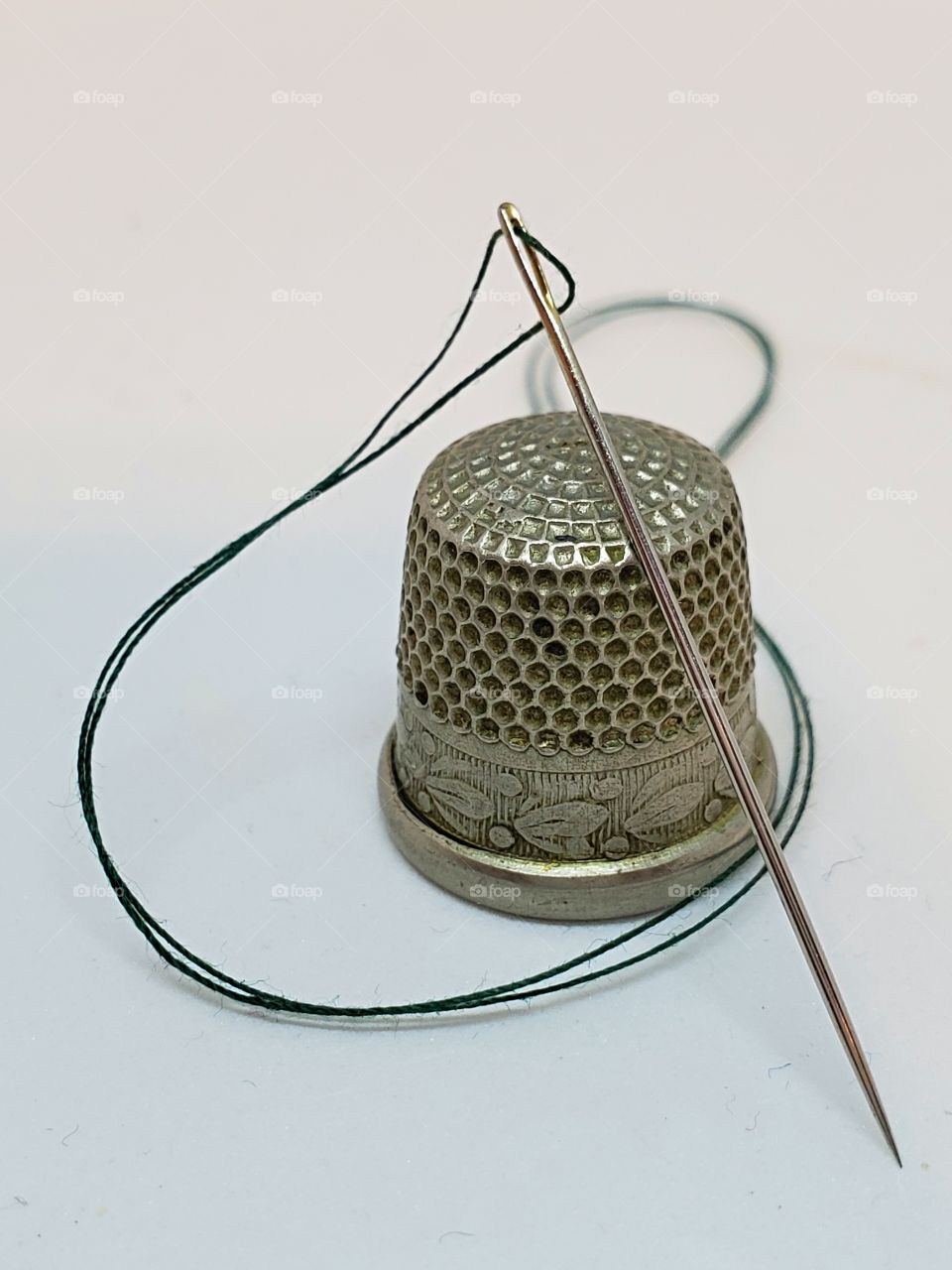 Vintage thimble with needle and thread!
