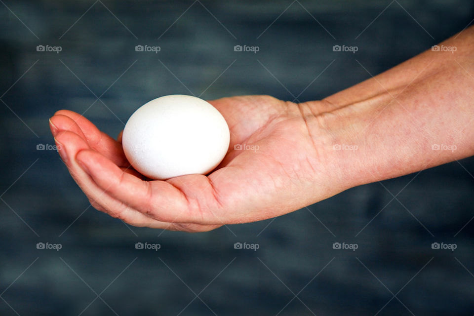 Egg in hand.