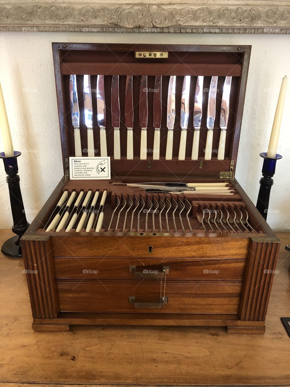 A canteen of cutlery resting in a center of craftsmanship that would be expected to adorn a stately home of exceptional merit.