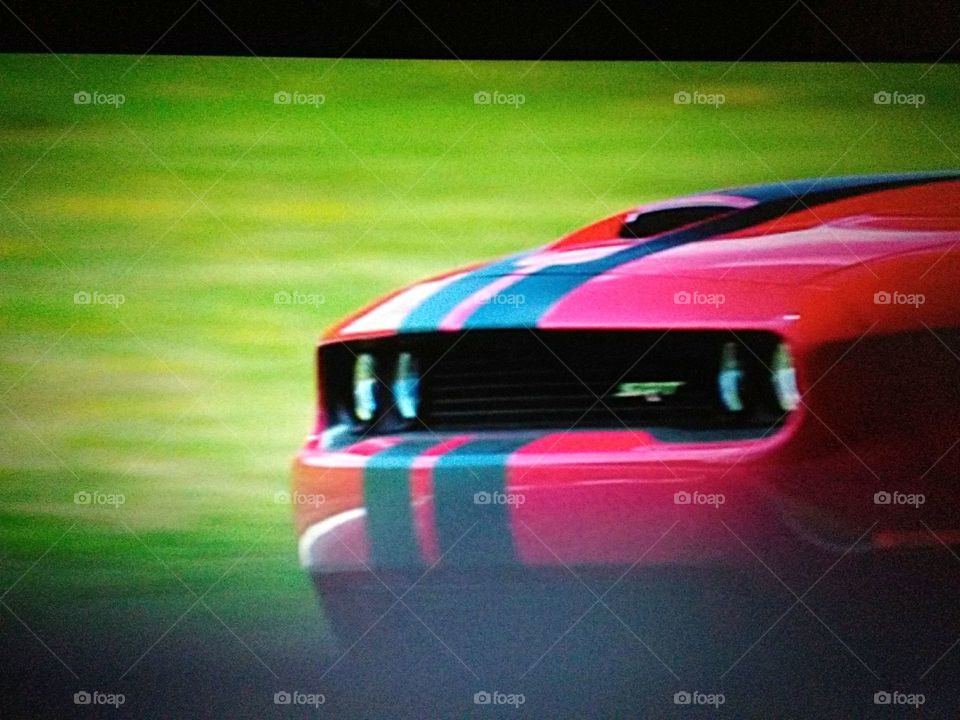 Red muscle car racing
