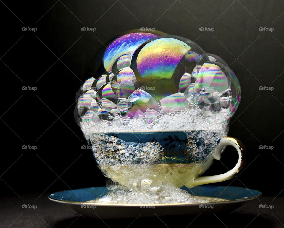 Bubbles in a cup with black background 