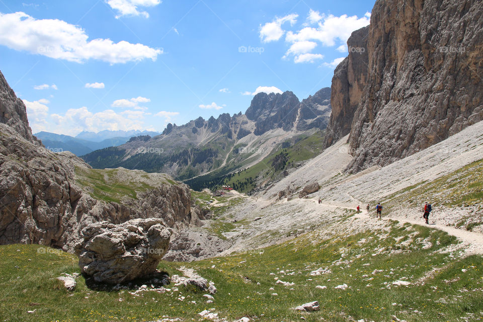 Hiking in the mountains of the Dolomites Italy on a beautiful summer day 