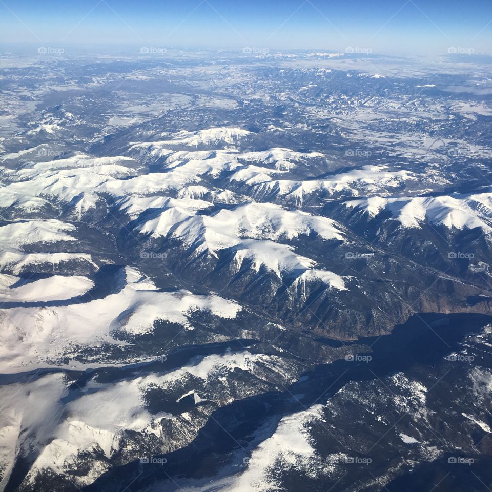 Aerial view of snow covered mountains