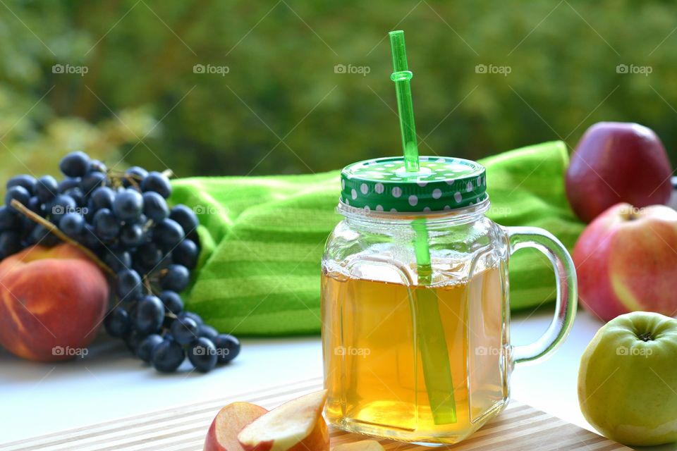 fruits juice and fruits green summer background