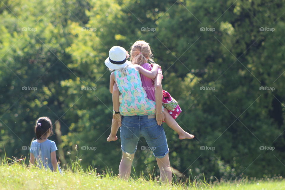 Piggy back rides in the park from mommy 