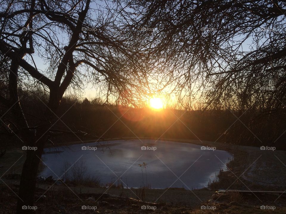 Sunrise and frozen lake