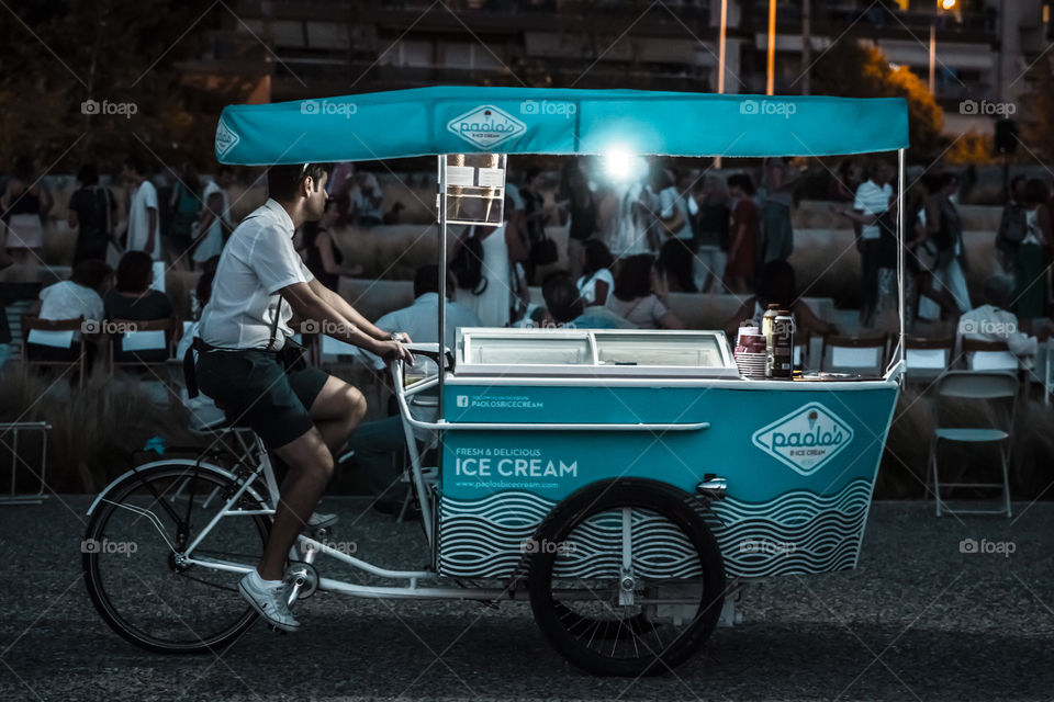 Mobile Ice Cream Bicycle Street Seller At Night
