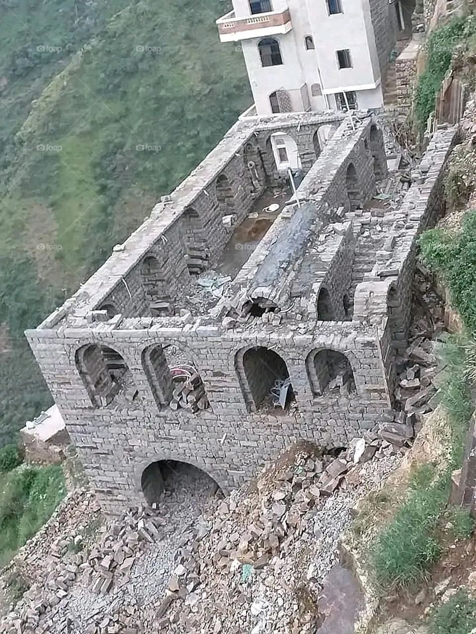 A stunning view of green mountains covered in fog in Yemen