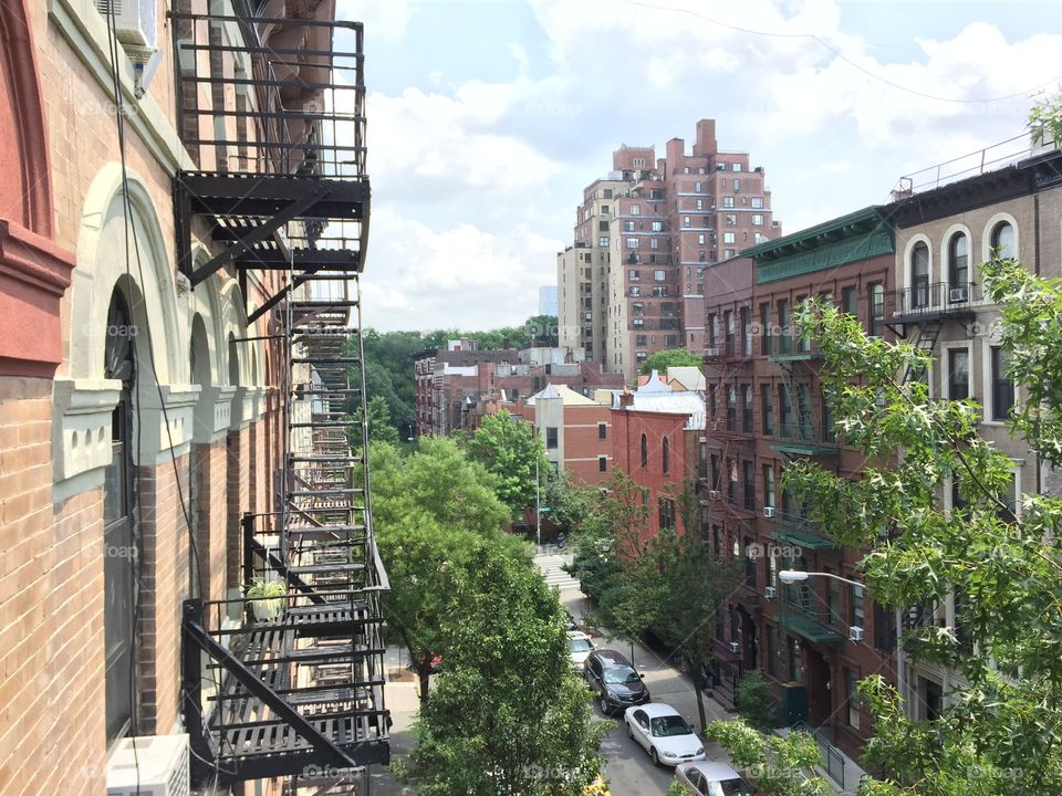 the fire escape. A beautiful summer day in Manhattan