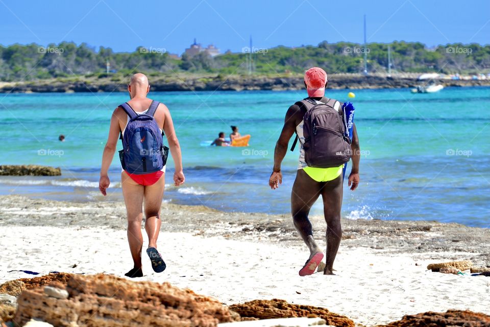 people on the beach having fun