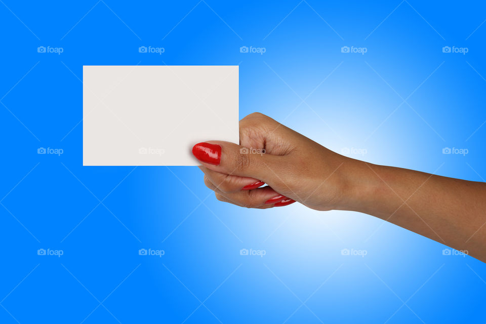 White blank business card in a female hand