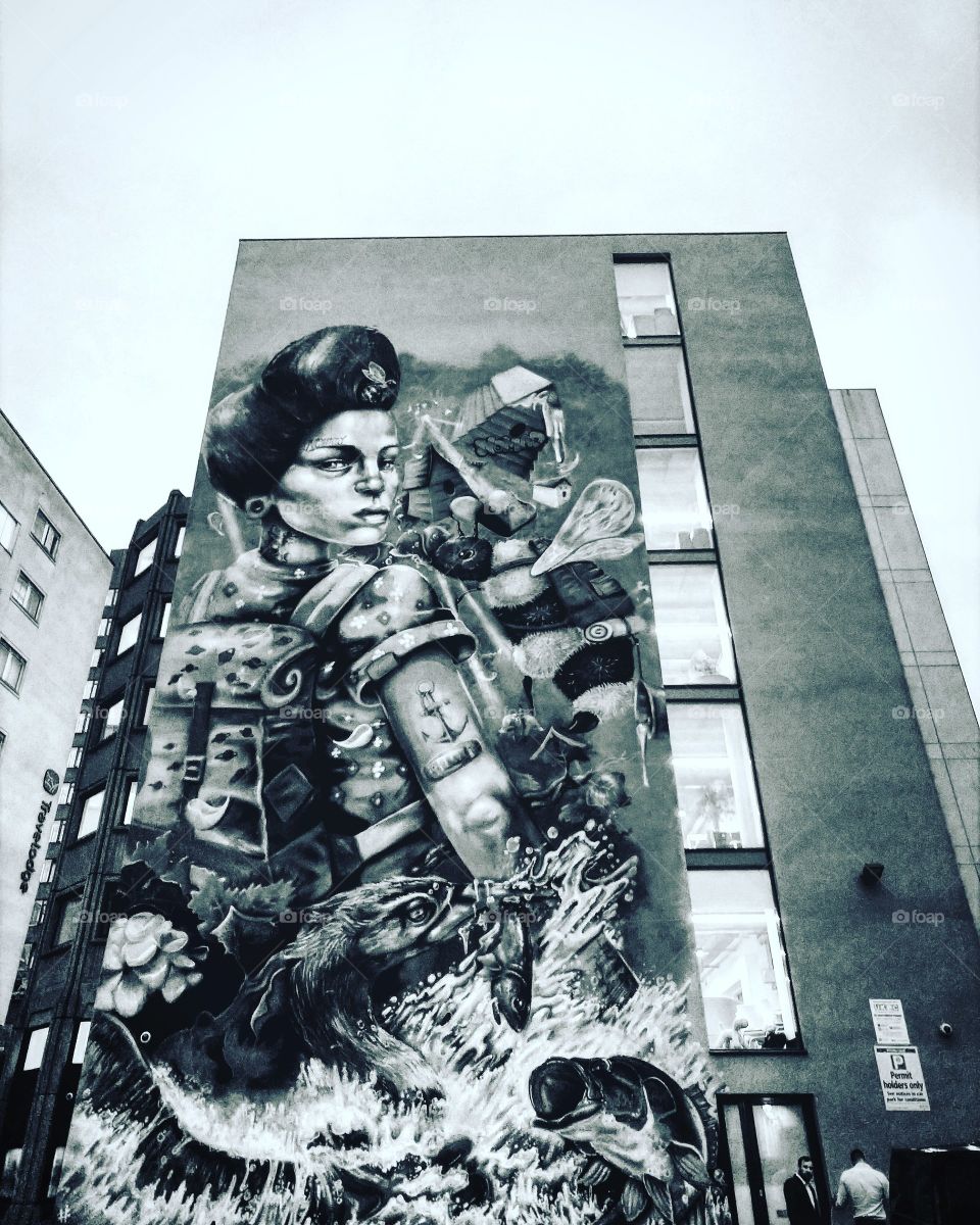 Powerful street art of powerful woman. Adventure is risk free