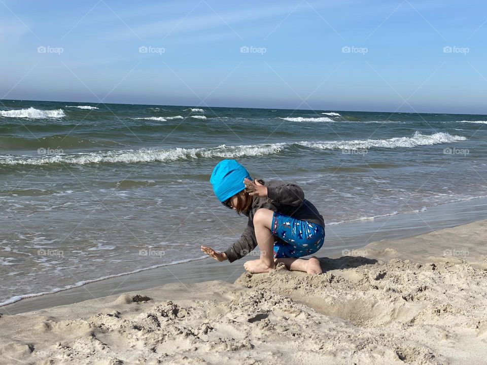 Boy playing on the beach