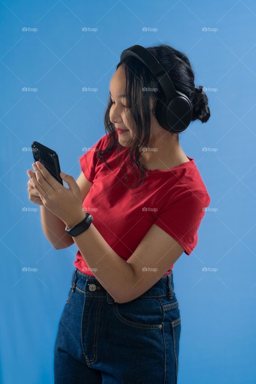 Teenage girl listening to music