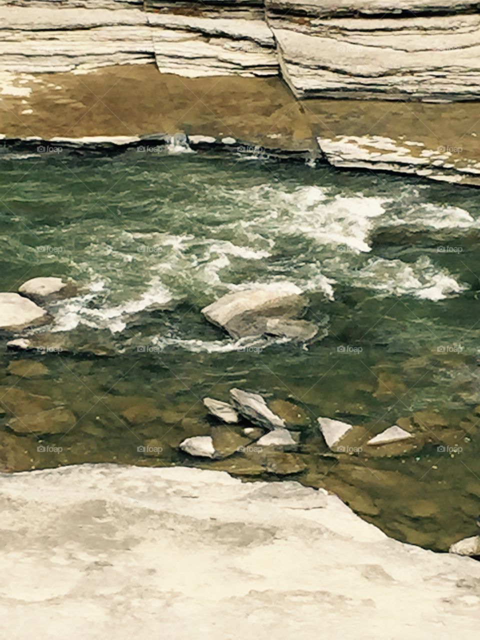 A beautiful rock riverbed in the country.