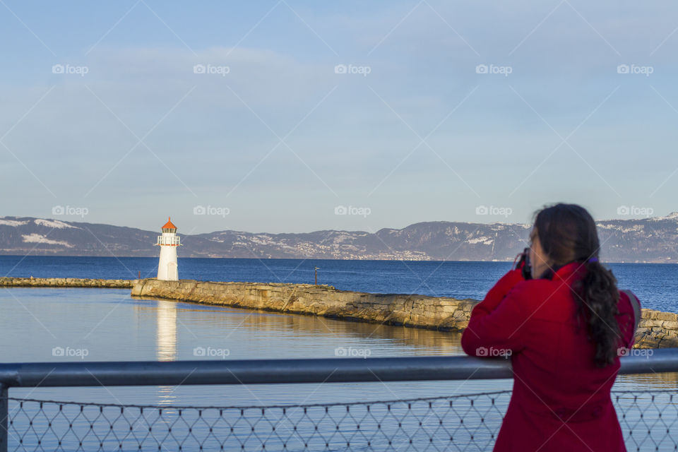 Girl taking a photo in Trondheim 