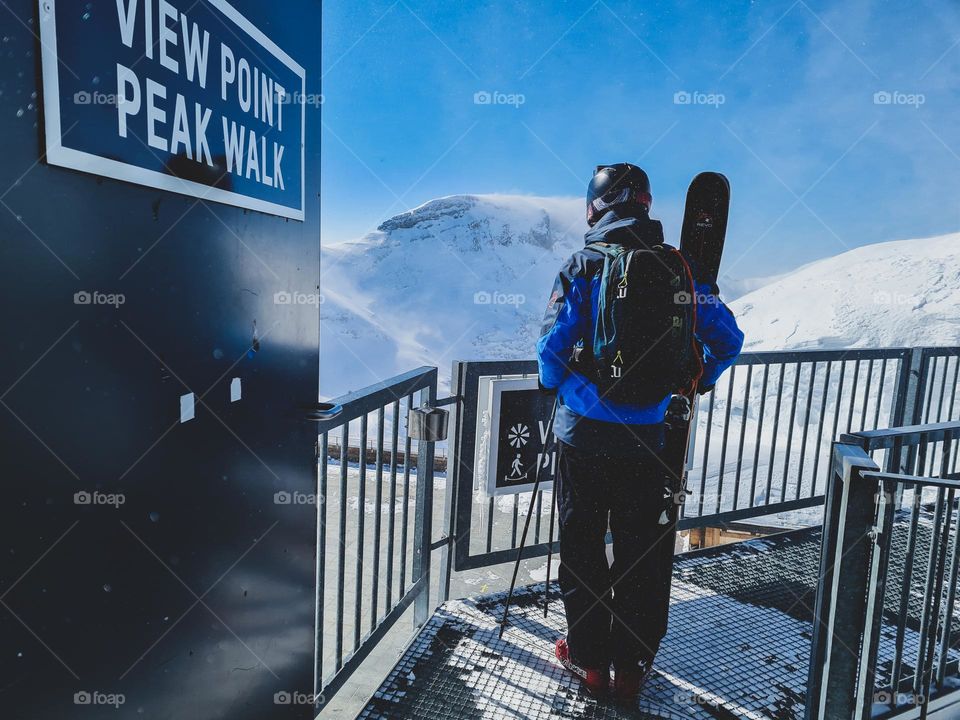 admiring the view before snowboarding