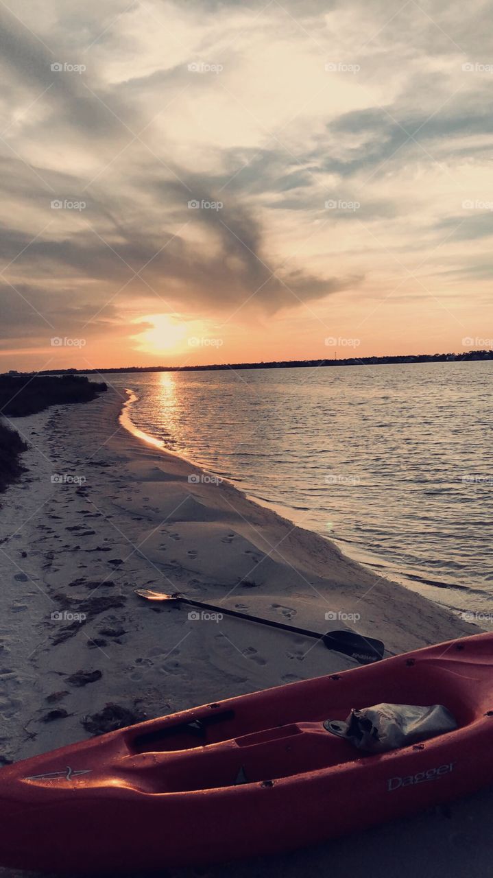 Sunset photo taken after a long kayak across the bay. Taken on a primitive beach camping trip.
