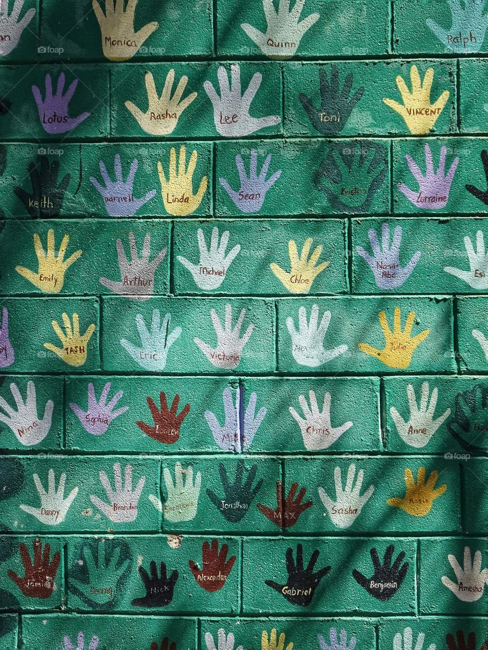 Hands and names on the wall