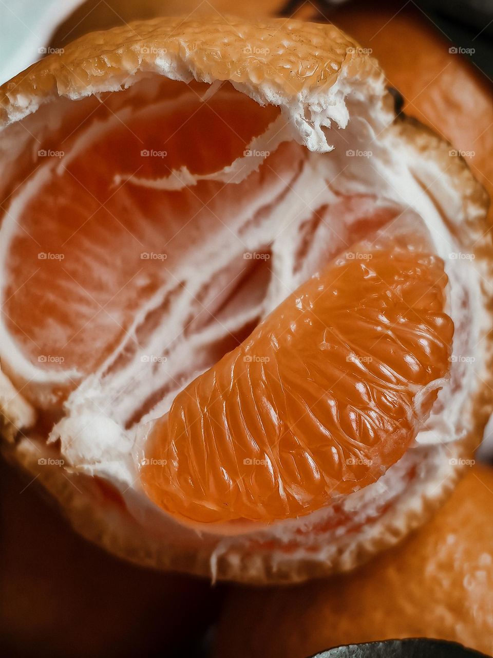 Half of a mandarin in close-up