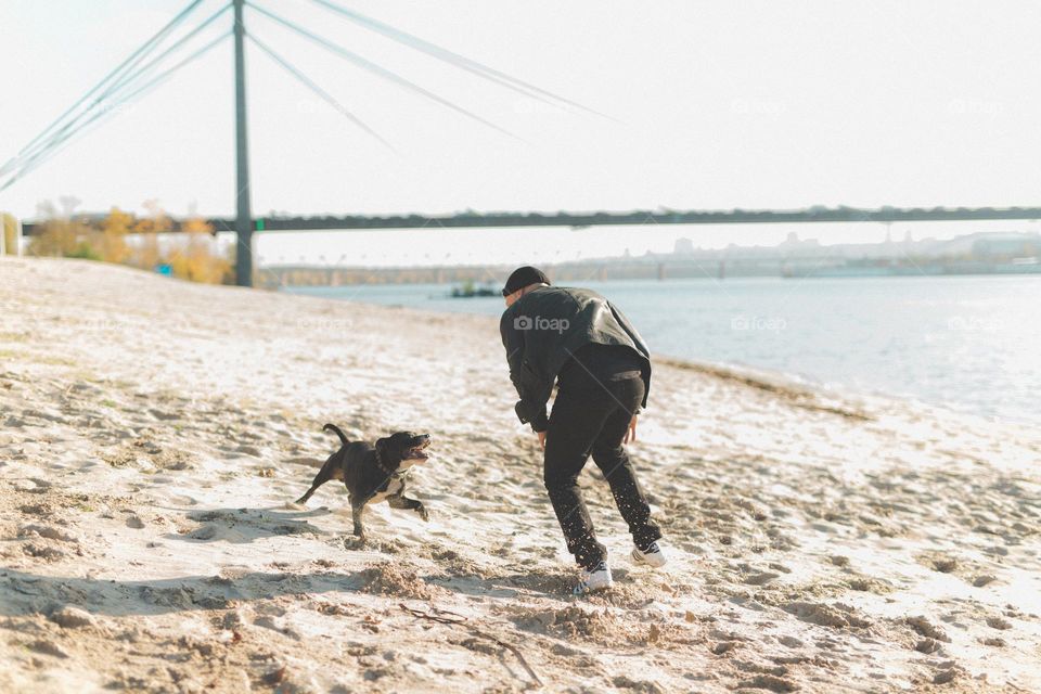 walking the dog, people walking the dogs on the street, they spend time together, the person plays with the dog, trains it, eat delicious food, take pictures. best friends are dogs. children and dogs for a walk