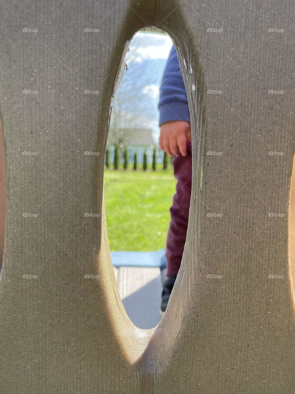 Child through play set window