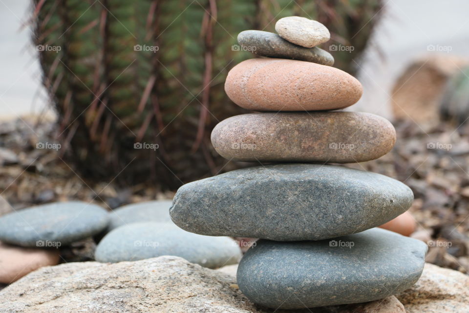 Stacked stones on rough rock