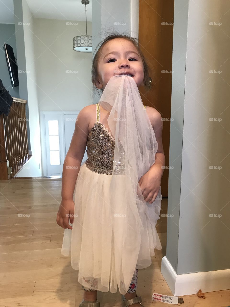 Little girl eats her dress