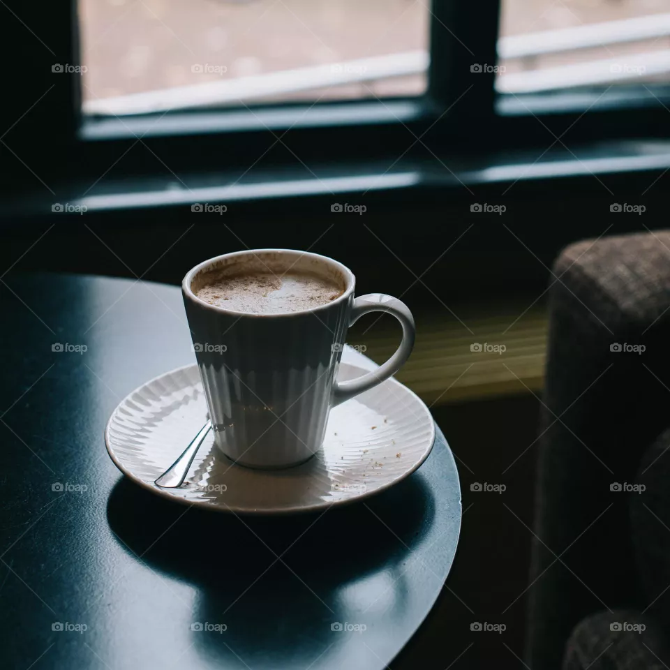 Coffee on the table in a cosy café